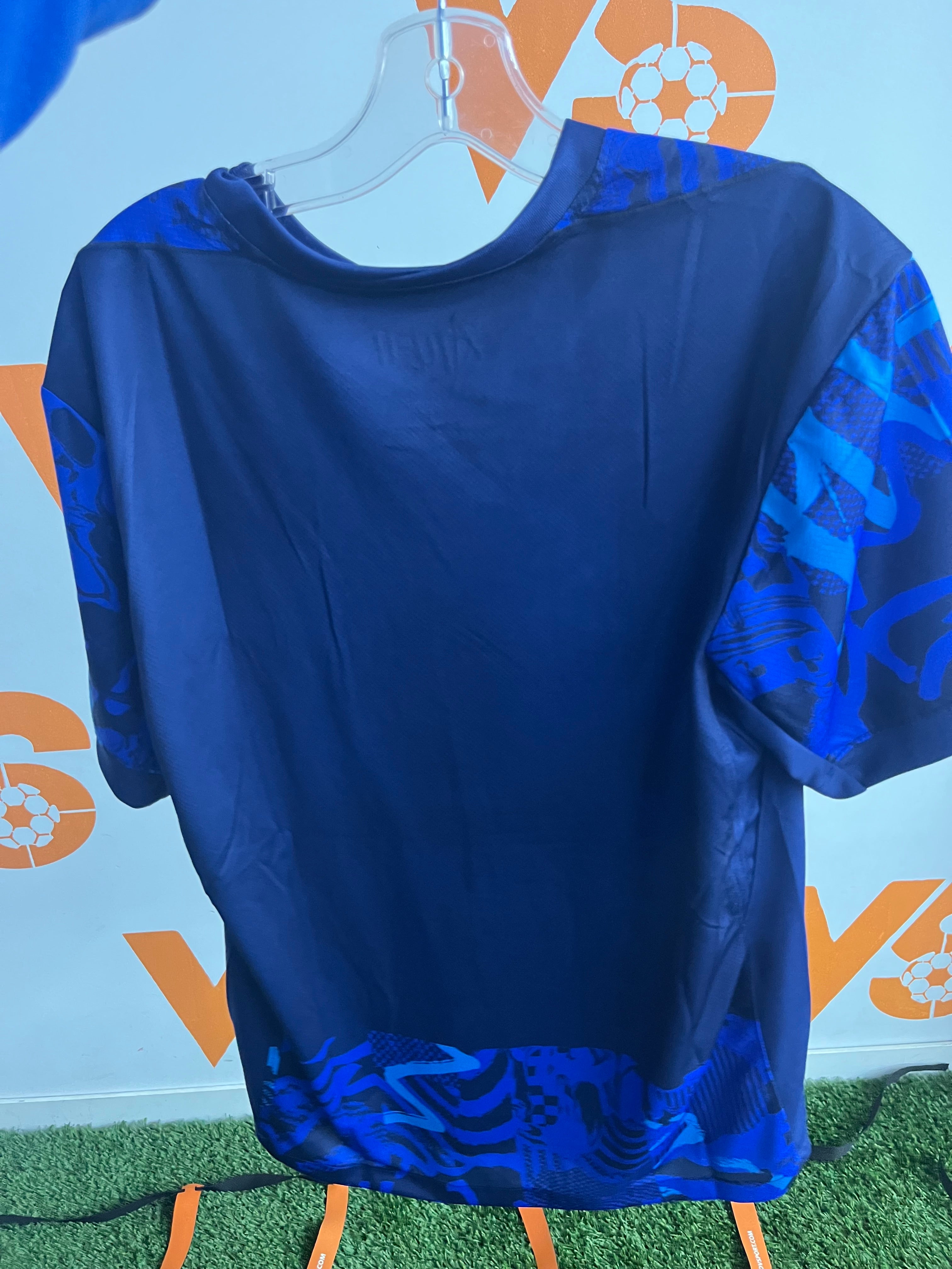 Atletico Madrid blue and pink jersey