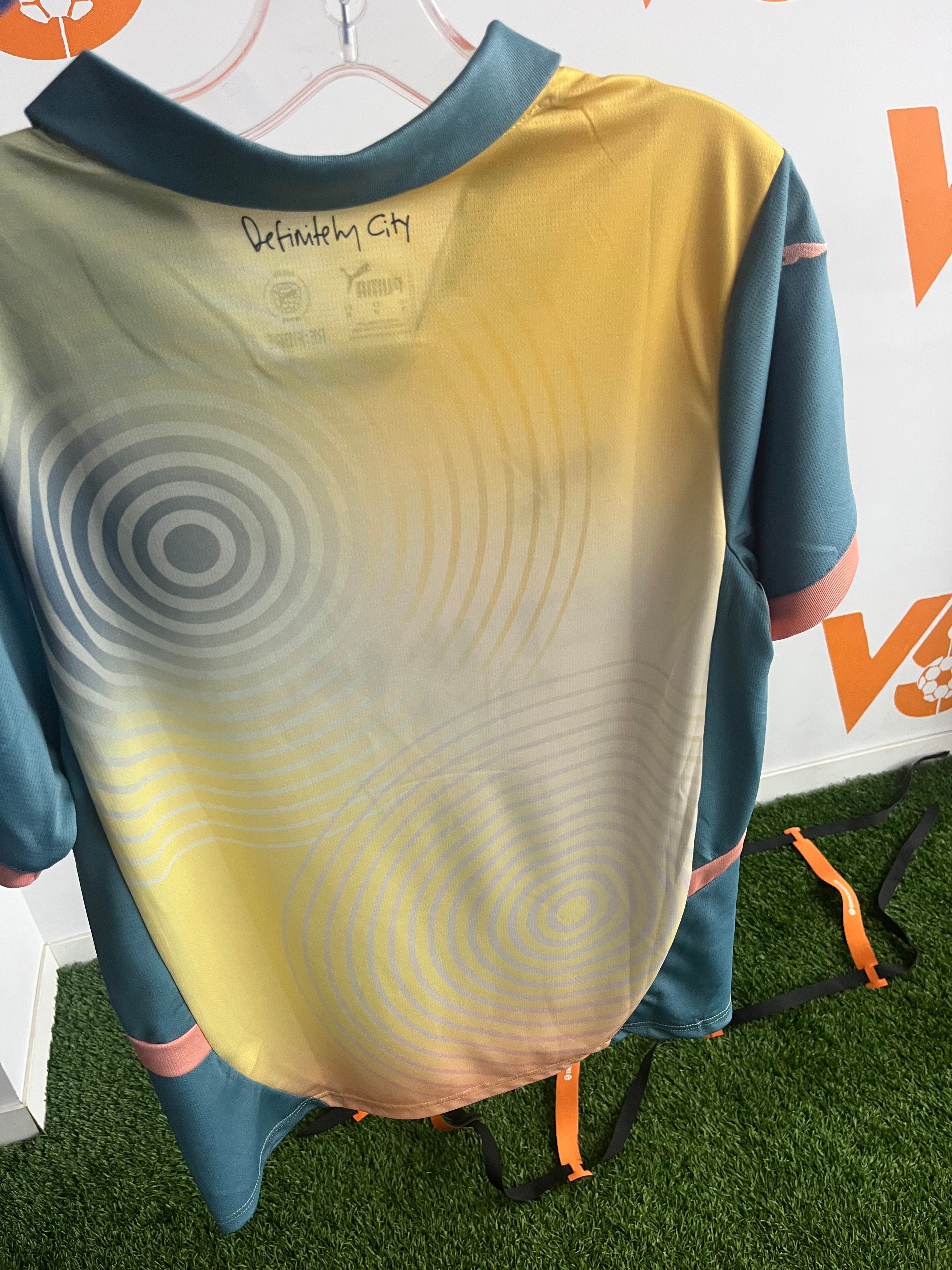 Manchester city gold & turquoise jersey